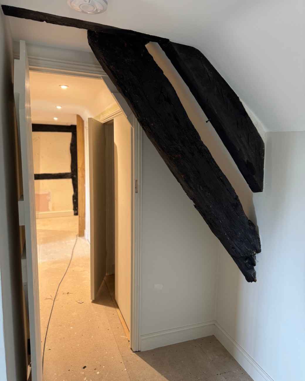 The same landing beam before restoration, painted solid black