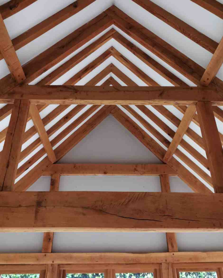 The same roof frame before restoration, orange under an old varnish